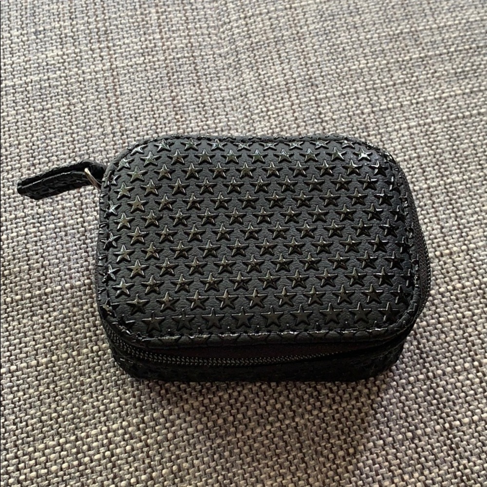 Small zippered case with star-embossed print